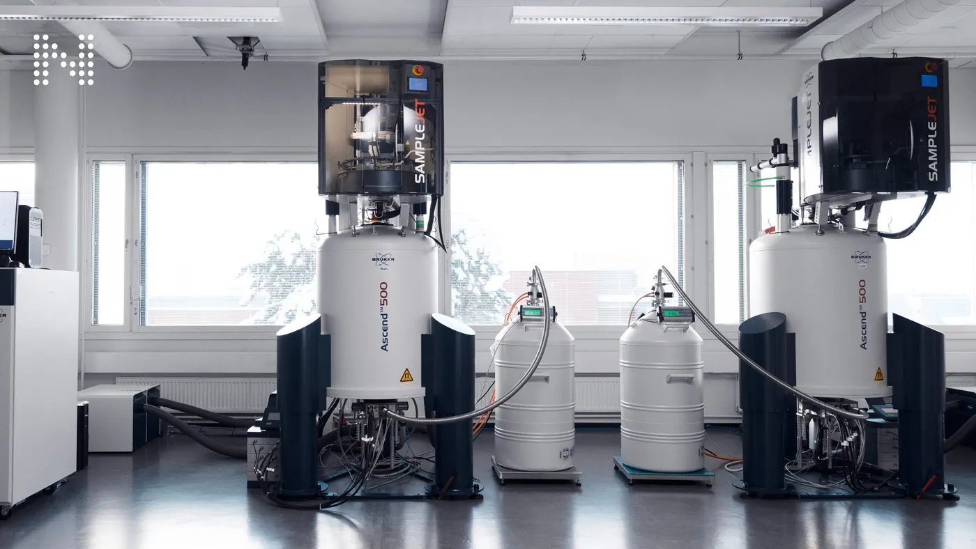 Two NMR spectrometers with automated sample changers in a Nightingale Health laboratory